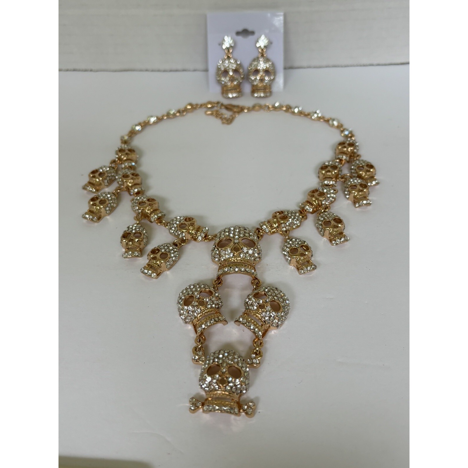 Goldtone Rhinestone Layered Skull Chain Statement Necklace Earring Set